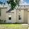 entrance to apartment homes with landscaping nearby