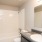 bathroom with modern finishes and a large tub