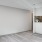 Open space living area with natural lighting and fireplace